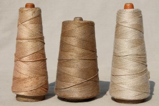 photo of antique ecru tan faded brown colors primitive grubby old spools of vintage cotton cord thread #3