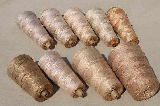photo of antique ecru tan faded brown colors primitive grubby old spools of vintage cotton cord thread #5