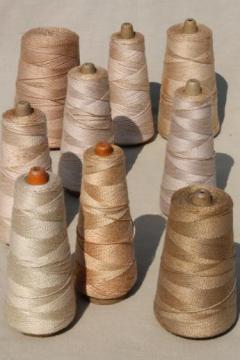 catalog photo of antique ecru tan faded brown colors primitive grubby old spools of vintage cotton cord thread