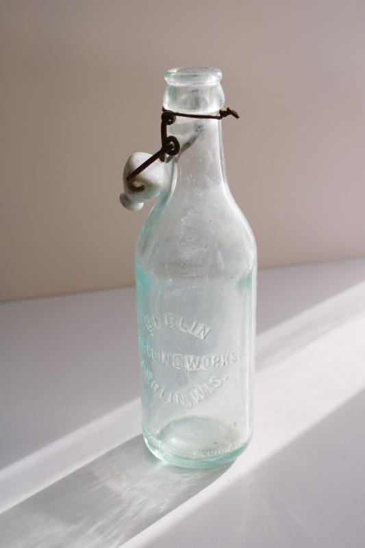 photo of antique embossed glass bottle Berlin Wisconsin Bottling Works, heavy aqua blue glass  #1