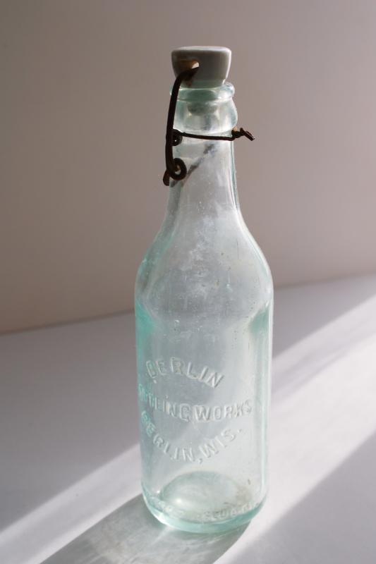 photo of antique embossed glass bottle Berlin Wisconsin Bottling Works, heavy aqua blue glass  #2