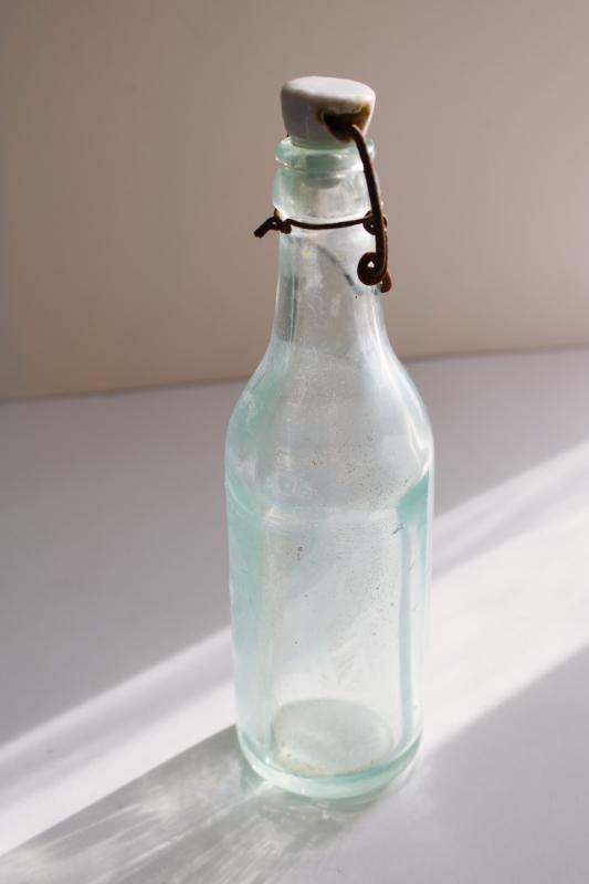 photo of antique embossed glass bottle Berlin Wisconsin Bottling Works, heavy aqua blue glass  #5