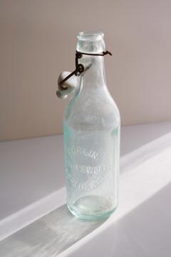 antique embossed glass bottle Berlin Wisconsin Bottling Works, heavy aqua blue glass 