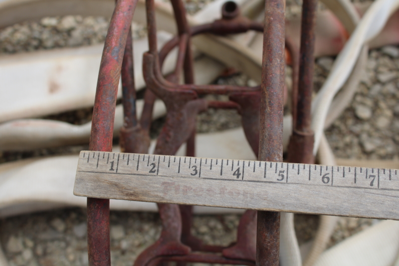 photo of antique fire hose reel, Wirt Knox cast iron wheel and mounting rack w/ Captain cotton rubber fire hose #9