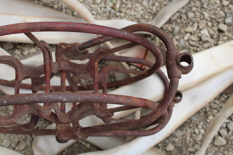 photo of antique fire hose reel, Wirt Knox cast iron wheel and mounting rack w/ Captain cotton rubber fire hose #13