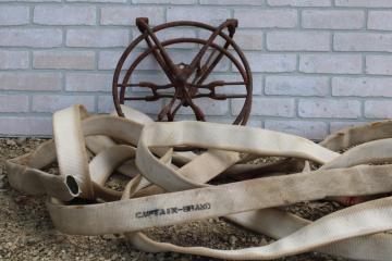 catalog photo of antique fire hose reel, Wirt Knox cast iron wheel and mounting rack w/ Captain cotton rubber fire hose