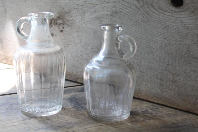 photo of antique glass bottles, early 1900s vintage syrup pitcher, clear glass jug #1