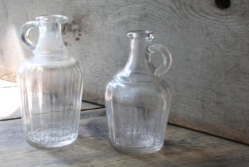 catalog photo of antique glass bottles, early 1900s vintage syrup pitcher, clear glass jug