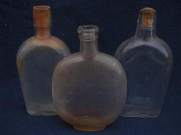 catalog photo of antique glass whiskey and old patent medicine bottles, vintage bottle lot