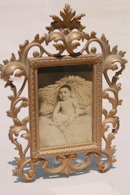 photo of antique gold cast metal picture frame w/ vintage sepia tone baby photo #1