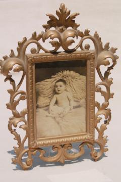 catalog photo of antique gold cast metal picture frame w/ vintage sepia tone baby photo