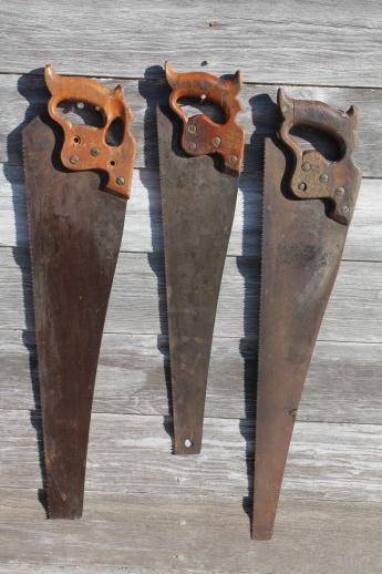 photo of antique hand saws, lot of Henry Disston saws 1860s medallion thumbhole handle #5