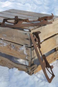 catalog photo of antique ice skates, adjustable steel ice skates to fit on boots or shoes