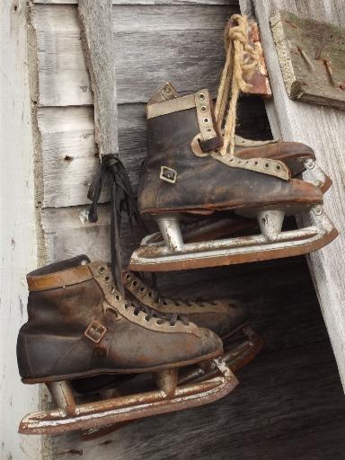 photo of antique ice skates, vintage leather boots hockey skates for display #1