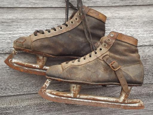 photo of antique ice skates, vintage leather boots hockey skates for display #4