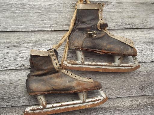 photo of antique ice skates, vintage leather boots hockey skates for display #8