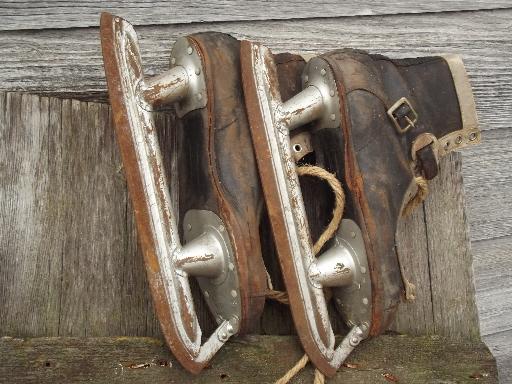 photo of antique ice skates, vintage leather boots hockey skates for display #10