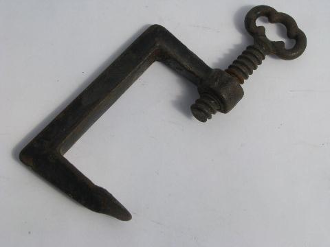 photo of antique iron clamp for kitchen or farm tools, clamps to table or work bench #1