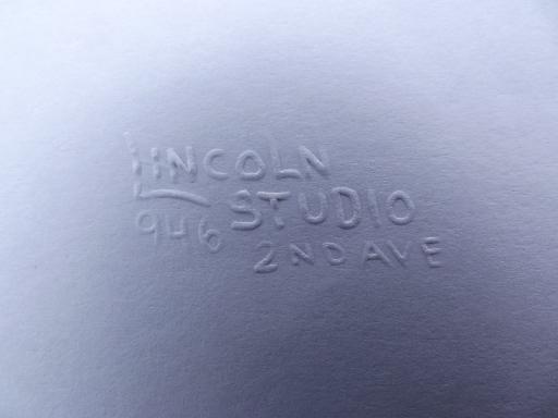 photo of antique iron hand press paper embossing stamp from photo studio, brass seal #5