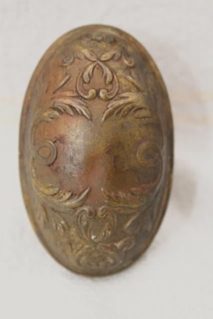 photo of antique oval brass door knob, original patina Aesthetic vintage door hardware #1