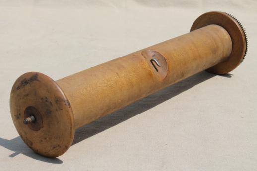 photo of antique player piano roller, large wooden spool to hold paper piano rolls #1