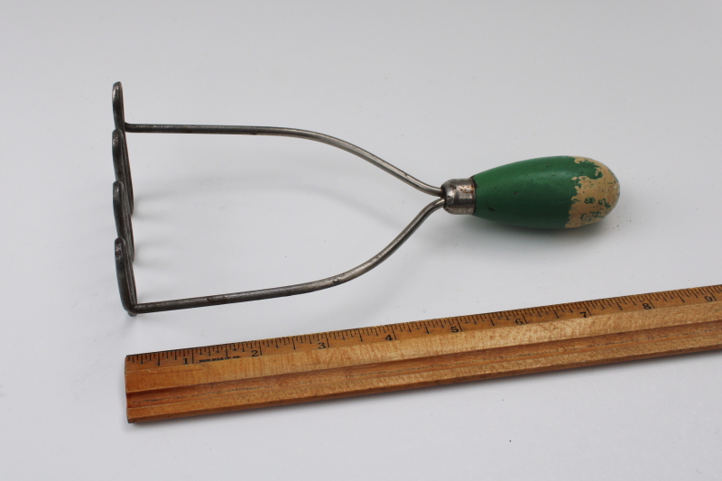 photo of antique potato masher w/ original old green painted wood handle, 1920s vintage #1