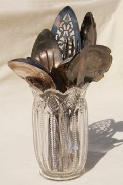 catalog photo of antique pressed glass spooner vase full of old silver flatware, vintage silverware lot