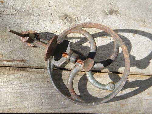 photo of antique primitive hand cranked tool spindle, /flywheel w/curved spokes #2