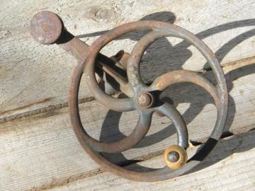 catalog photo of antique primitive hand cranked tool spindle, /flywheel w/curved spokes