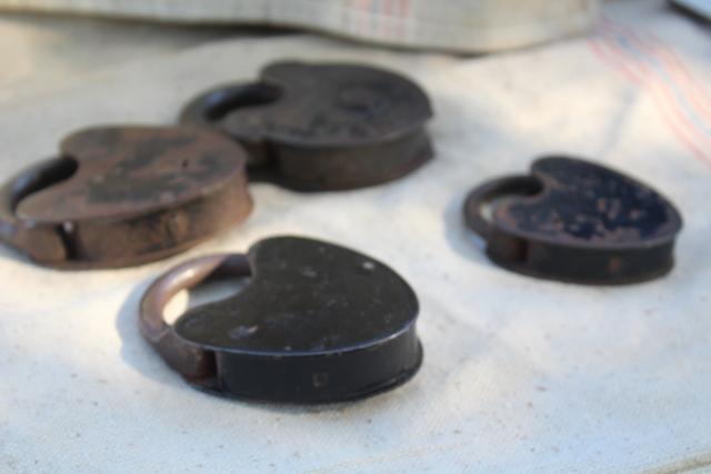 photo of antique railroad locks, iron padlocks w/ brass lock cover, primitive heart shape #8