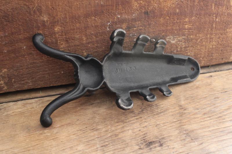 photo of antique reproduction cast iron beetle boot jack, vintage Iron Art bootjack  #2