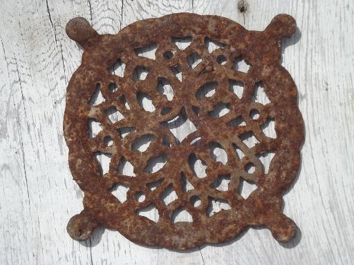 photo of antique rusty iron trivets, primitive vintage round trivet collection #3