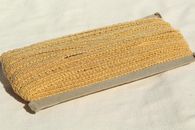 photo of antique sewing millinery trim, big spools of black & gold braid, cotton twill tape #10