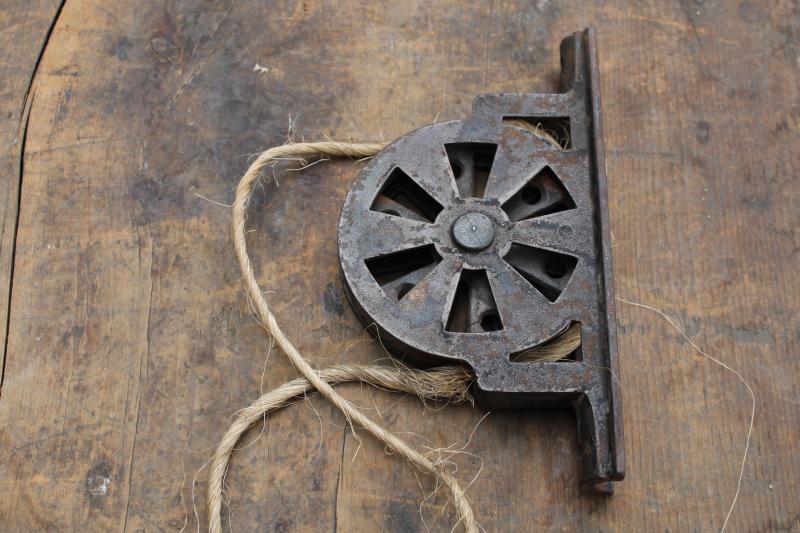 photo of antique steel pulley, vintage industrial style window or door lift hardware #1