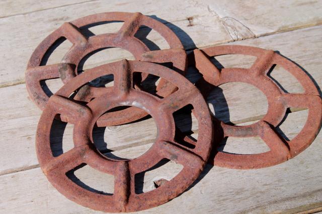 photo of antique stove burners, rusty crusty vintage junk yard primitive industrial wall art decor #1