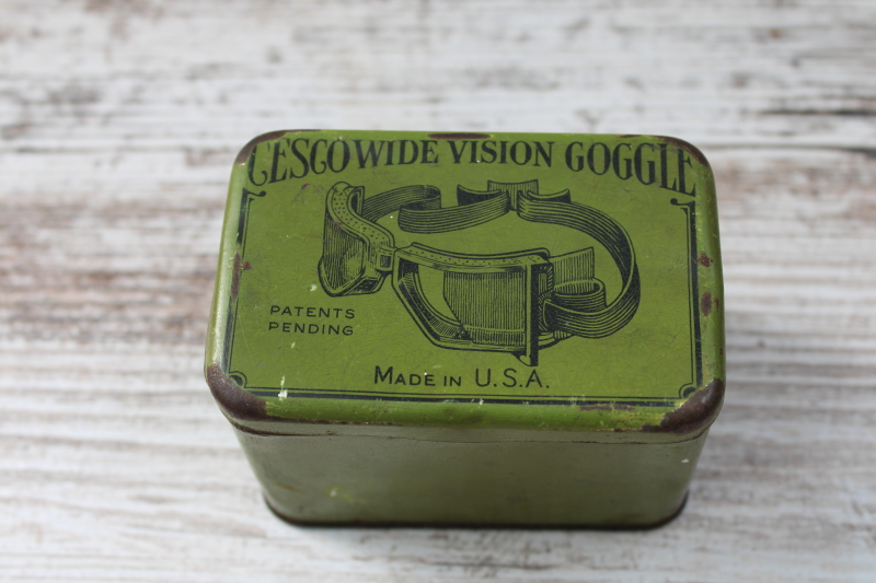 photo of antique tin for steampunk style auto or motorcycle goggles, 1920s vintage graphics print on green metal #1
