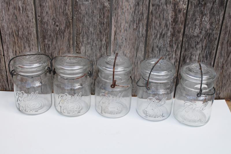 photo of antique vintage Ball Ideal Mason clear glass jars w/ wire bail lightning lids #1