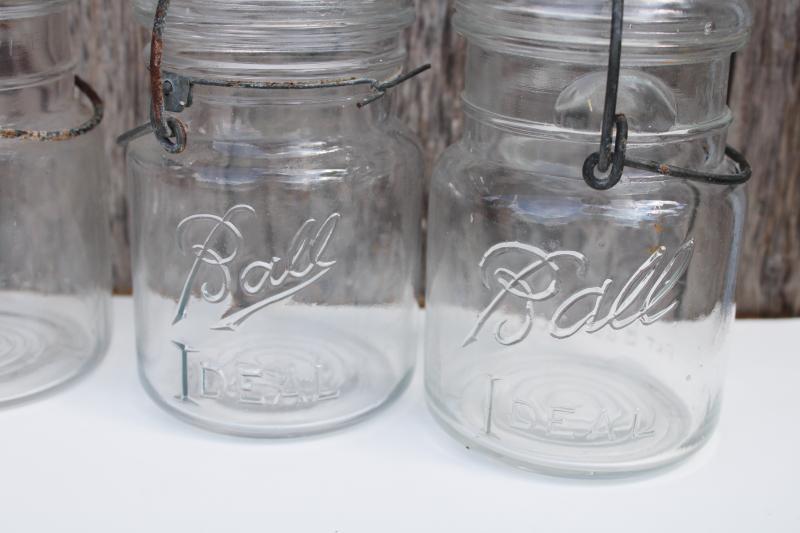 photo of antique vintage Ball Ideal Mason clear glass jars w/ wire bail lightning lids #2