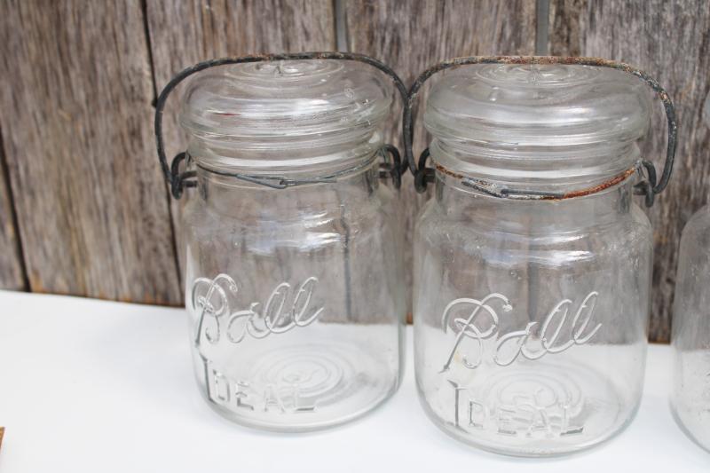 photo of antique vintage Ball Ideal Mason clear glass jars w/ wire bail lightning lids #5