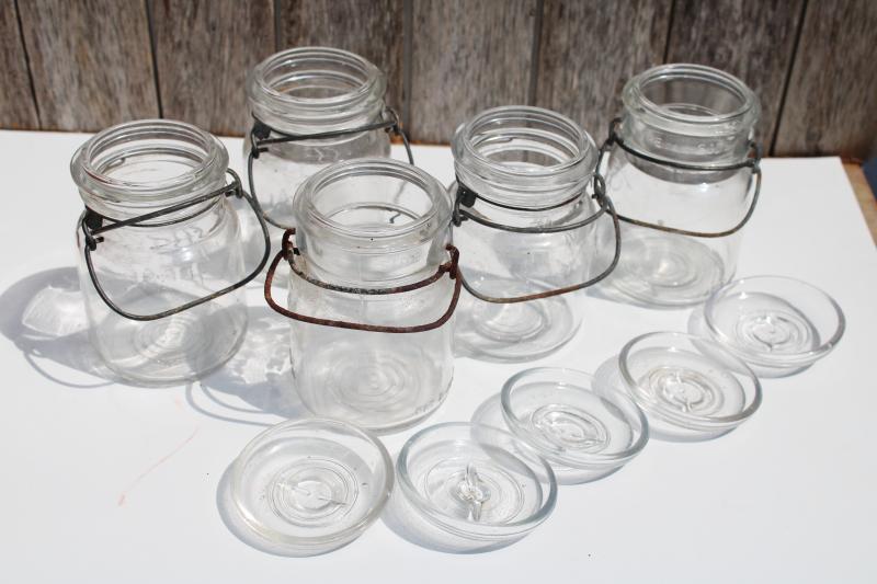 photo of antique vintage Ball Ideal Mason clear glass jars w/ wire bail lightning lids #9