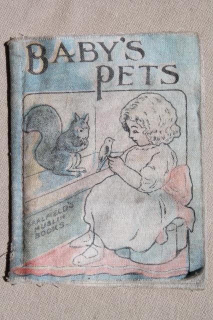 photo of antique vintage cloth book Baby's Pets w/ animal illustrations, Saalfield's muslin book #1