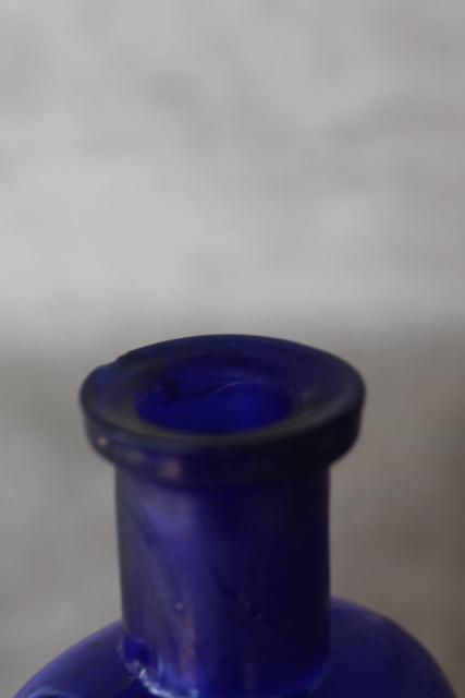 photo of antique vintage embossed glass medicine bottle St George's Pharmacy cobalt blue glass #2