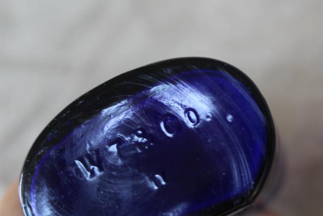 photo of antique vintage embossed glass medicine bottle St George's Pharmacy cobalt blue glass #4