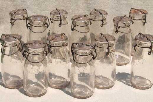 photo of antique vintage glass bottles, half pint glass fruit preserves jars w/ metal lids #1