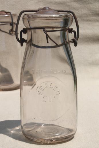 photo of antique vintage glass bottles, half pint glass fruit preserves jars w/ metal lids #5
