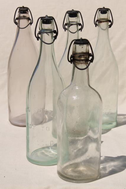 photo of antique & vintage glass bottles w/ wire bail lids, old embossed glass wine bottles #1