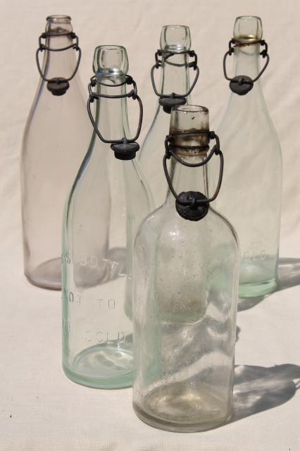 photo of antique & vintage glass bottles w/ wire bail lids, old embossed glass wine bottles #2