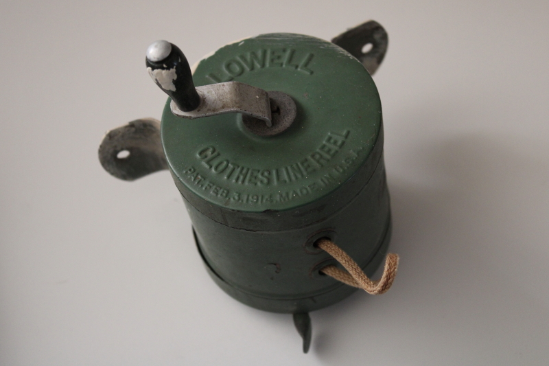 photo of antique vintage wall mount clothesline, green metal hand crank reel w/ embossed 1914 patent date #2