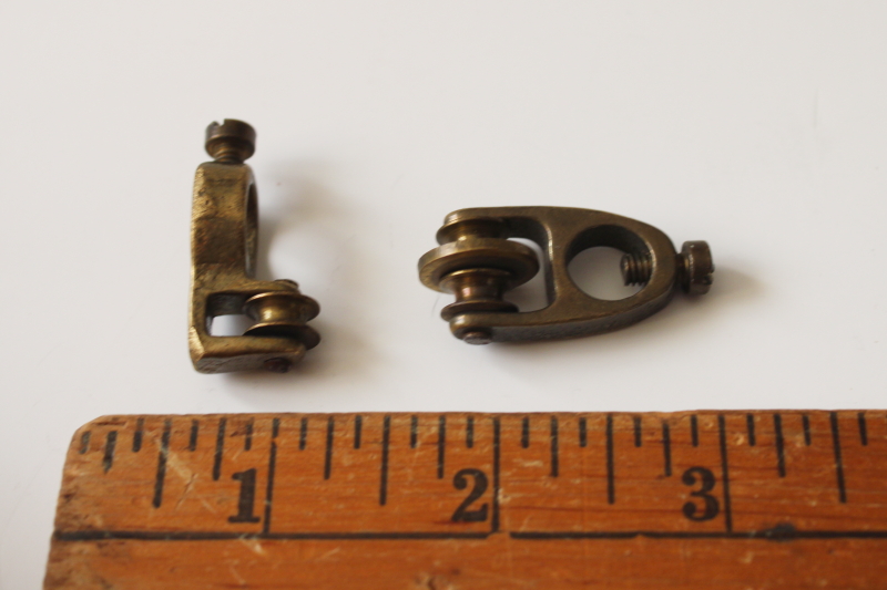 photo of antique window curtain hardware, tiny solid brass pulleys to draw panel sideways w/ downward pull  #1