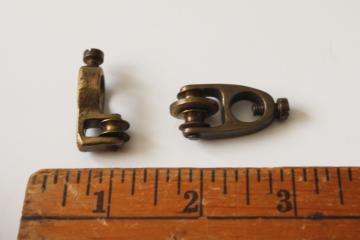 catalog photo of antique window curtain hardware, tiny solid brass pulleys to draw panel sideways w/ downward pull 